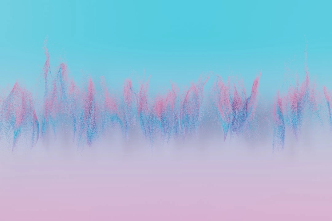 a blurry photo of pink and blue flowers