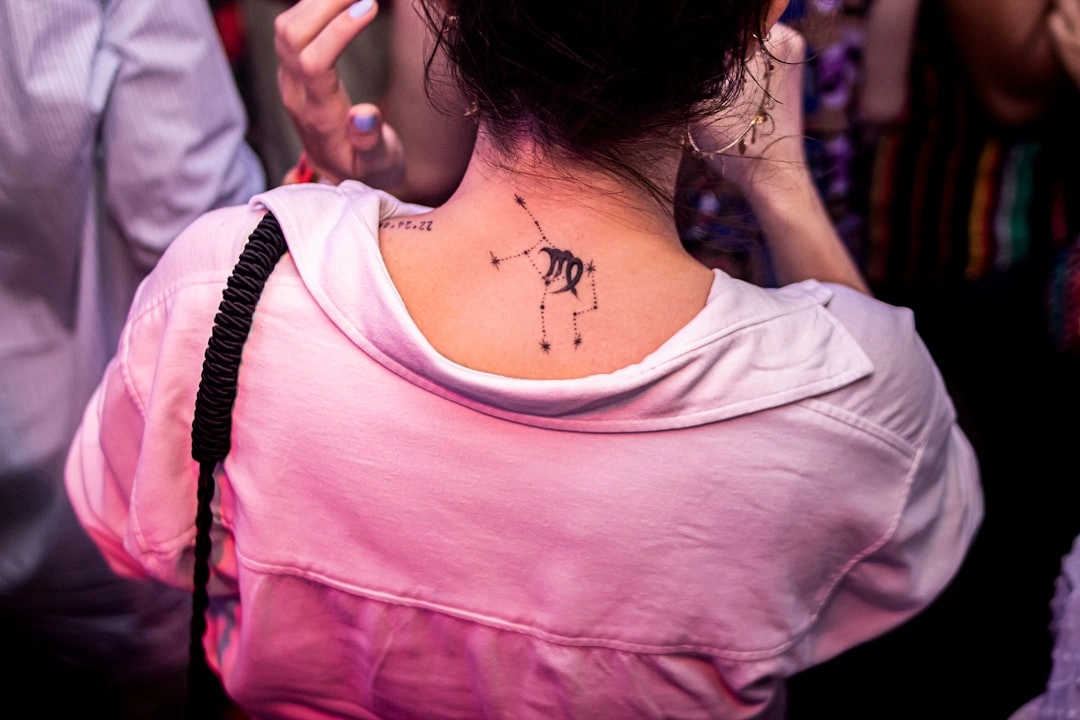 a woman with a tattoo on her back